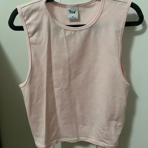 Aritzia light pink top in brand new condition only being worn 1-2 times.
